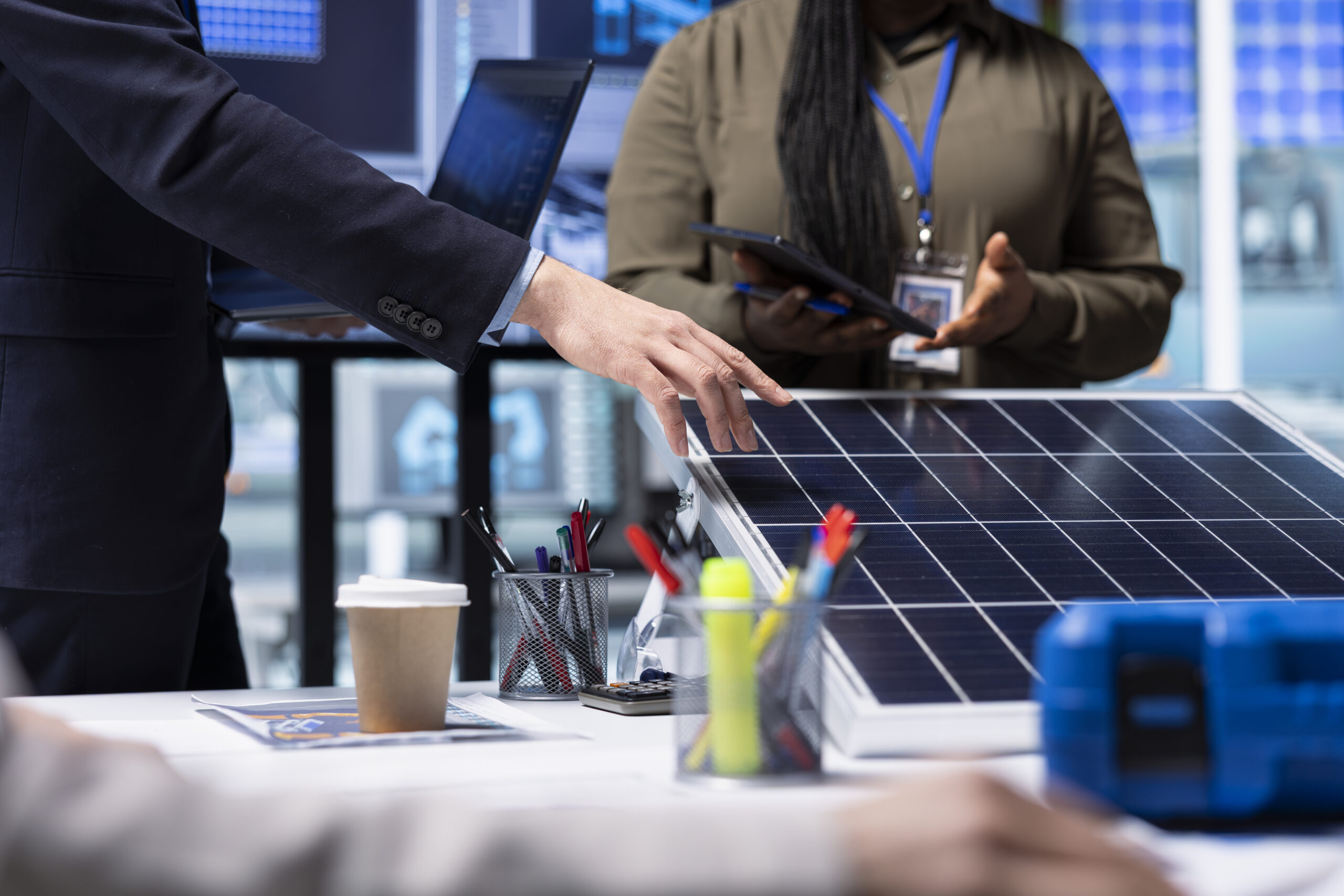 investors meet with photovoltaics factory experts to review solar cell designs